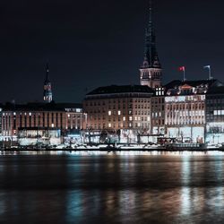 Illuminated buildings in city at night