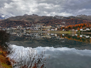 Scenic view of lake and mountains against sky st moritz