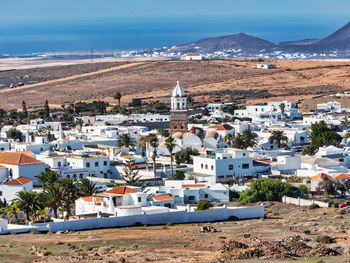 High angle view of townscape by sea