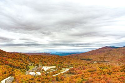 High angle view of countryside landscape against cloudy sky