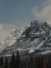 Low angle view of snowcapped mountain against sky