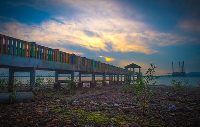 Scenic view of beach against sky during sunset