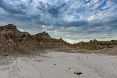 Scenic view of mountains against cloudy sky