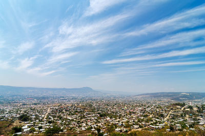 Aerial view of cityscape against sky