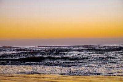 Scenic view of sea at sunset