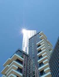 Low angle view of skyscraper against clear sky