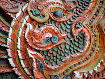 Close-up of angel statue against temple