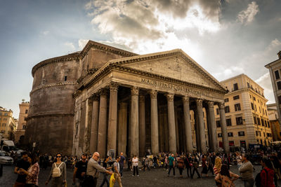 Group of people in front of historical building