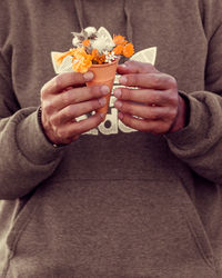 Close-up of man eating ice cream in winter