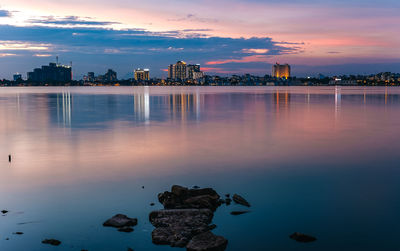 Scenic view of lake against sky during sunset