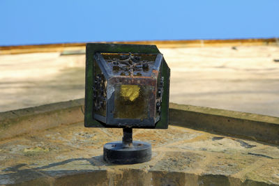 Close-up of rusty metal lamp