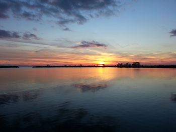 Scenic view of lake at sunset