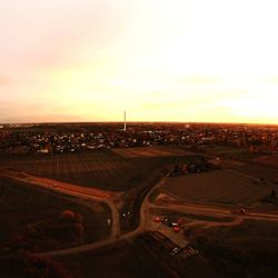 High angle view of city street against sky during sunset