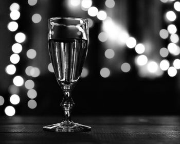 Close-up of wine glasses on table