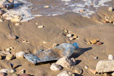 Plastic pollution with bottles washed up by the atlantic ocean on the beach, agadir, morocco, africa