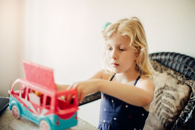 Girl with toy at home