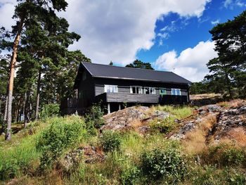 House on field against sky