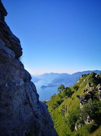 Scenic view of mountains against clear blue sky