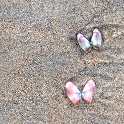 High angle view of heart shape on sand