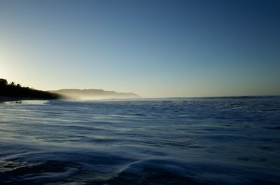 Scenic view of sea against clear blue sky