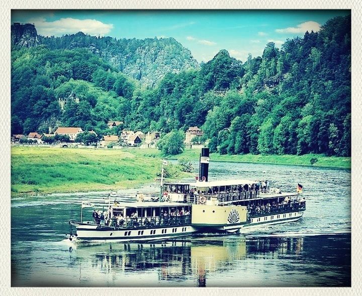 transfer print, water, tree, mountain, auto post production filter, lake, transportation, river, tranquil scene, tranquility, scenics, nature, waterfront, sky, beauty in nature, green color, nautical vessel, day, boat, mode of transport