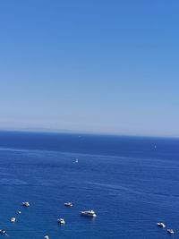 Scenic view of blue sea against clear sky