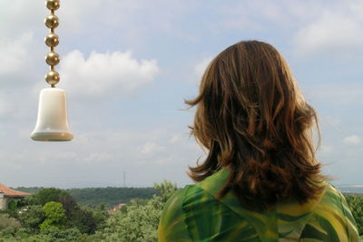 Close-up of woman against sky