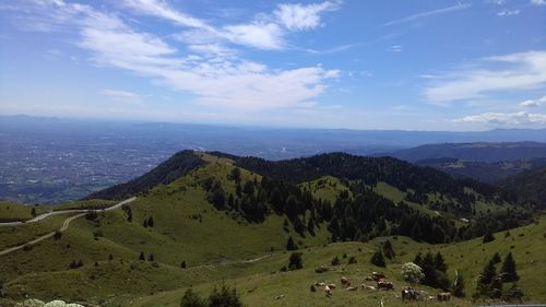 Scenic view of mountains against cloudy sky