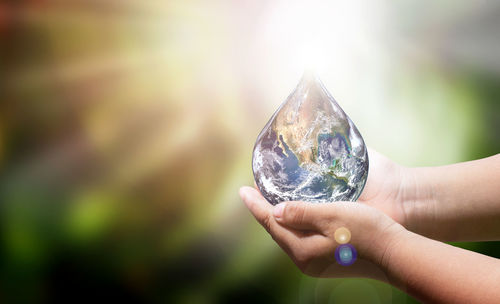 Close-up of hand holding glass