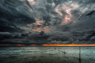 Scenic view of sea against dramatic sky