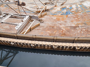 Rusty bottom of wastewater tank. sediment removal and sieve cleaning. sewage tank before maintenance