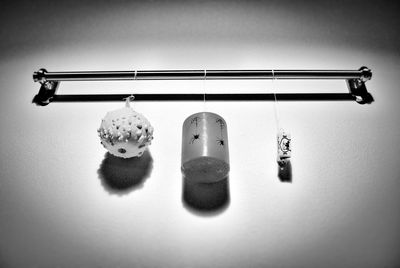 Close-up of objects hanging on metal