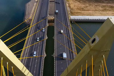 Low angle view of suspension bridge against sky