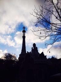 Low angle view of silhouette temple against sky
