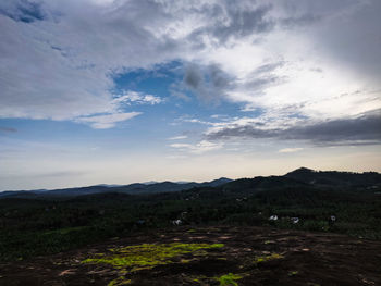 Scenic view of field against sky during sunset