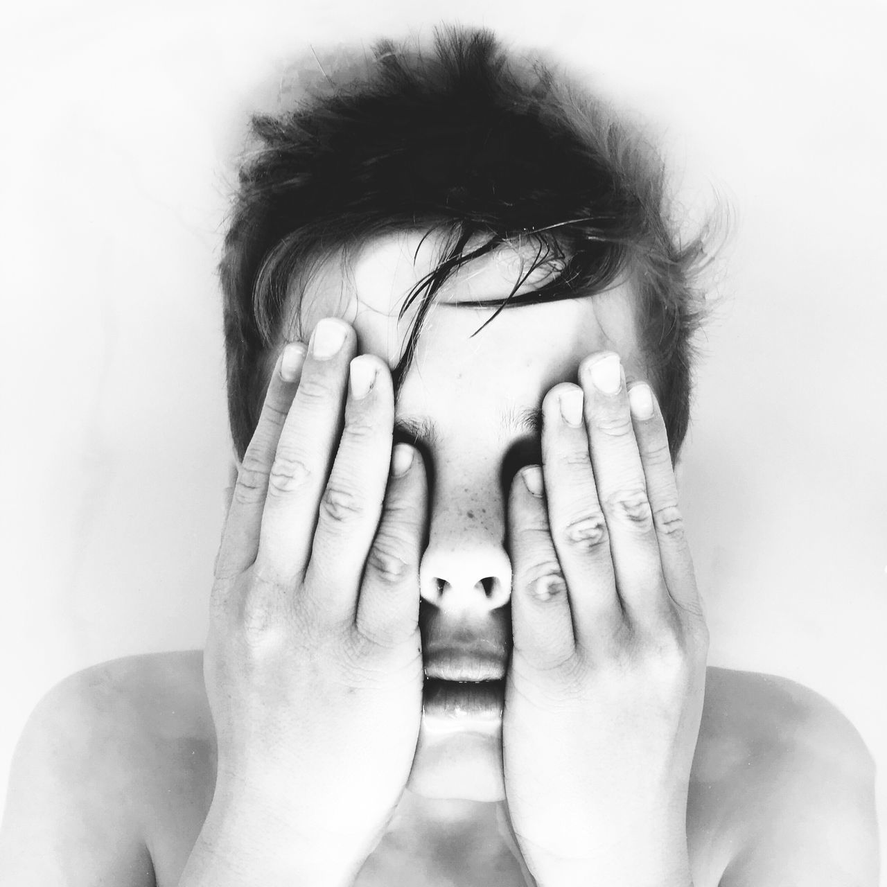 CLOSE-UP OF YOUNG WOMAN OVER WHITE BACKGROUND