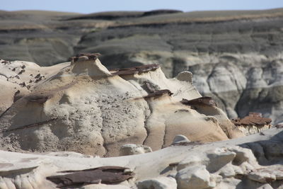 Rocks on mountain against sky