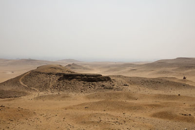 Scenic view of desert against clear sky