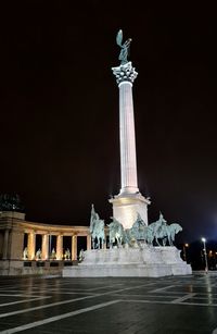 Low angle view of statue at night