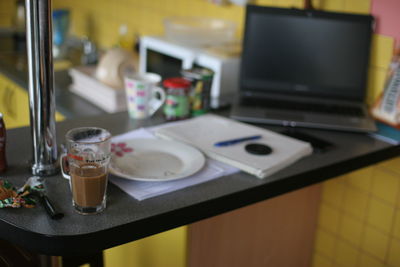 Close-up of electric lamp on table at home
