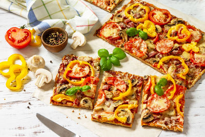 High angle view of pizza served on table