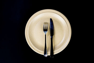 Directly above shot of electric lamp against black background