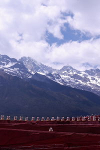 Scenic view of snowcapped mountains against sky