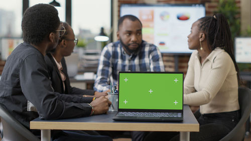 Man using laptop at office