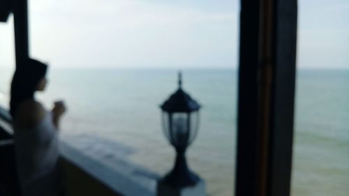 Close-up of sea seen through window