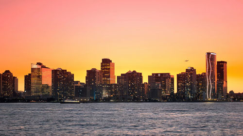 City at waterfront during sunset,new york skyline