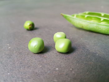 Close-up of green peas on table