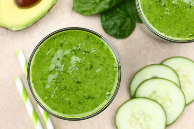 High angle view of green fruits in glass