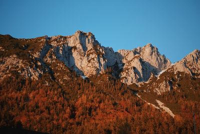 Scenic view of mountains against clear blue sky