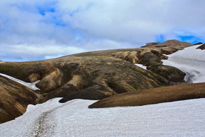 Scenic view of laugavegur against cloudy sky during winter